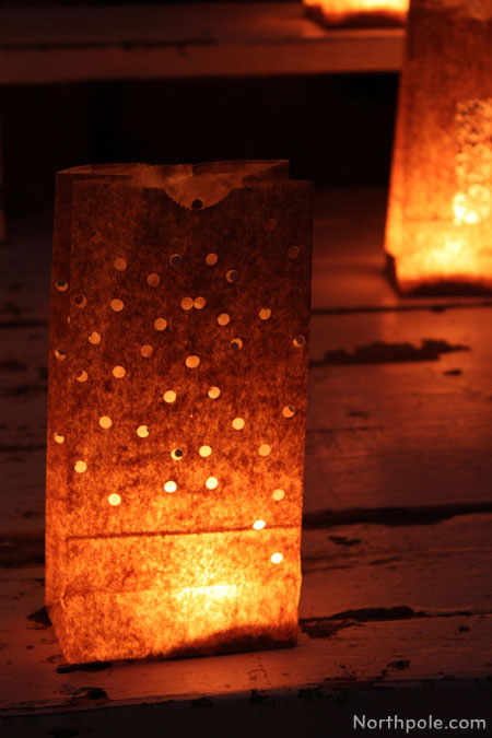 Paper Bag Luminaries: Use a 1/4 inch one-hole punch to cut out dots all over the bag.